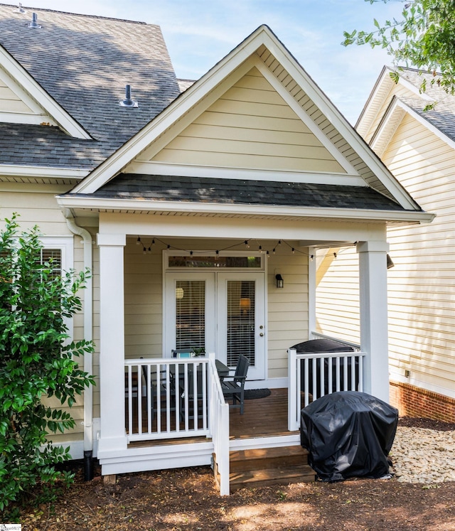 19 Edge Ct Unit A, Greenville, SC 29609 - doorway to property featuring a shingled roof and covered porch