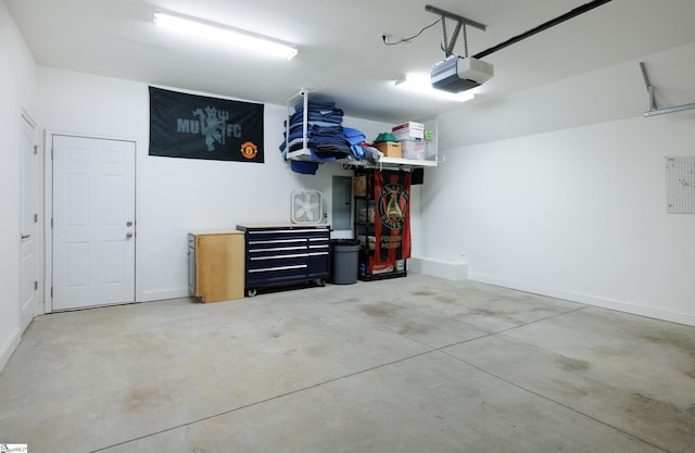 19 Edge Ct Unit A, Greenville, SC 29609 - garage with a garage door opener and baseboards