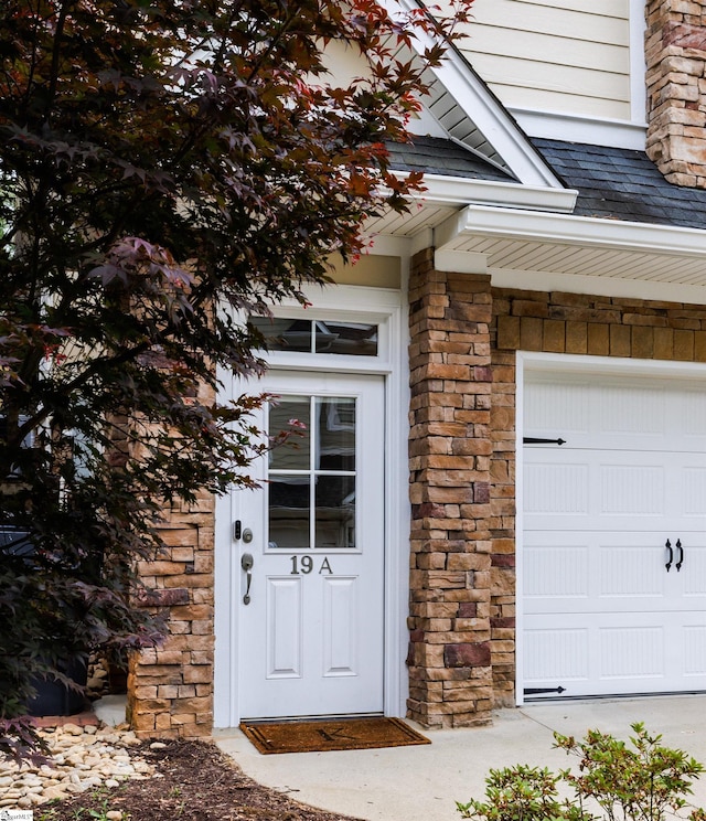19 Edge Ct Unit A, Greenville, SC 29609 - property entrance with a garage and stone siding