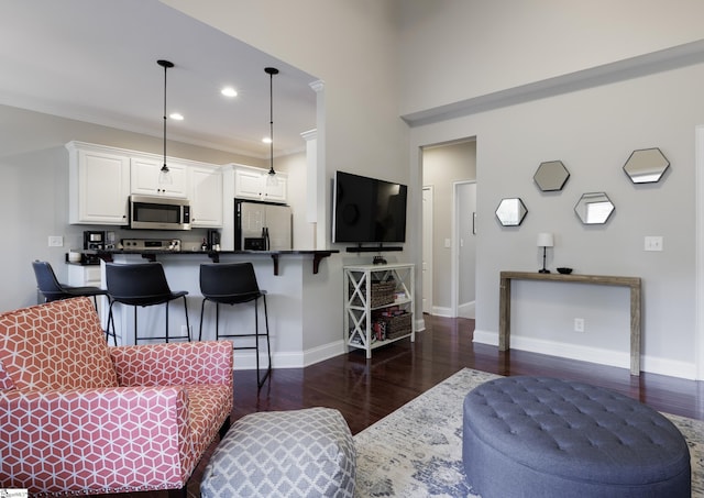 19 Edge Ct Unit A, Greenville, SC 29609 - living room featuring dark wood-style flooring, baseboards, recessed lighting, and ornamental molding