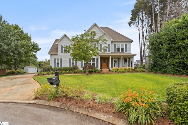 4 Jester Ct, Simpsonville, SC 29681 - view of front facade featuring covered porch, a front yard, concrete driveway, and an outdoor structure