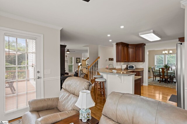 4 Jester Ct, Simpsonville, SC 29681 - living area featuring ornamental molding, ceiling fan, light wood-style floors, a chandelier, and recessed lighting
