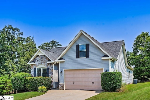 30 Caperton Way, Greer, SC 29651 - traditional-style house with concrete driveway, a garage, stone siding, roof with shingles, and a front lawn