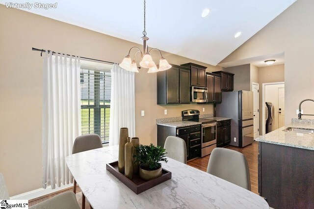 30 Caperton Way, Greer, SC 29651 - dining space with a chandelier, dark wood finished floors, and high vaulted ceiling