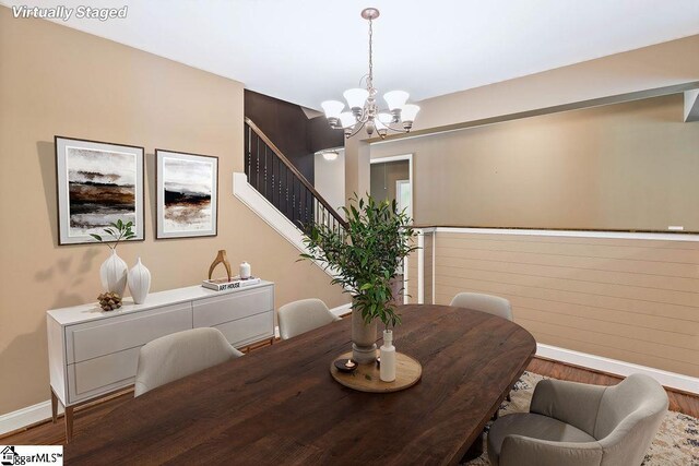 30 Caperton Way, Greer, SC 29651 - dining area with baseboards, wood finished floors, a chandelier, and stairway