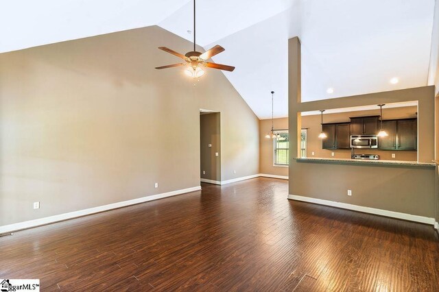 30 Caperton Way, Greer, SC 29651 - unfurnished living room with high vaulted ceiling, ceiling fan, a chandelier, baseboards, and dark wood-style floors