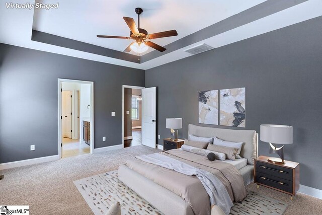 30 Caperton Way, Greer, SC 29651 - bedroom featuring light carpet, a tray ceiling, baseboards, and a ceiling fan