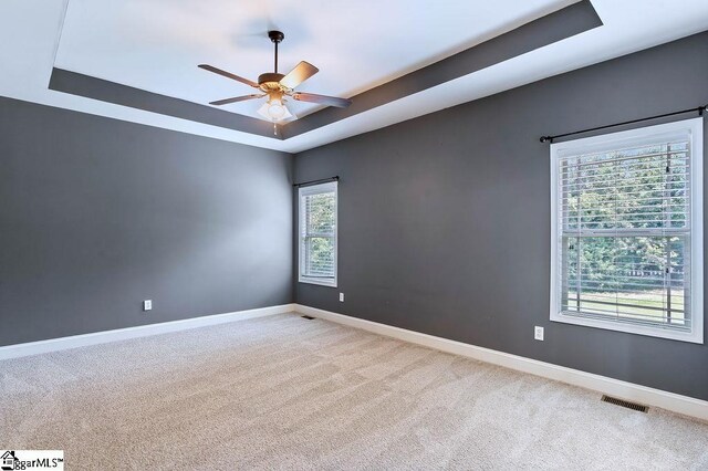 30 Caperton Way, Greer, SC 29651 - carpeted empty room featuring a raised ceiling, ceiling fan, and baseboards