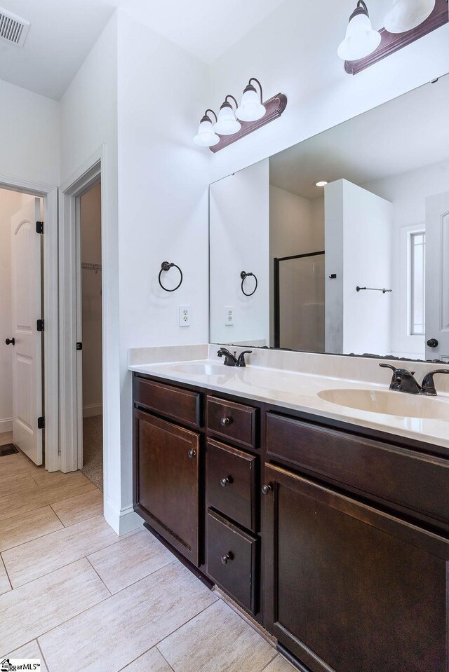 30 Caperton Way, Greer, SC 29651 - bathroom with wood finished floors, double vanity, and a walk in closet