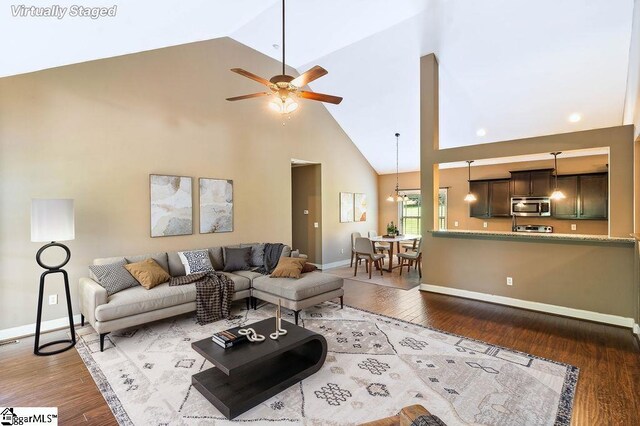 30 Caperton Way, Greer, SC 29651 - living area featuring high vaulted ceiling, wood finished floors, ceiling fan, and baseboards