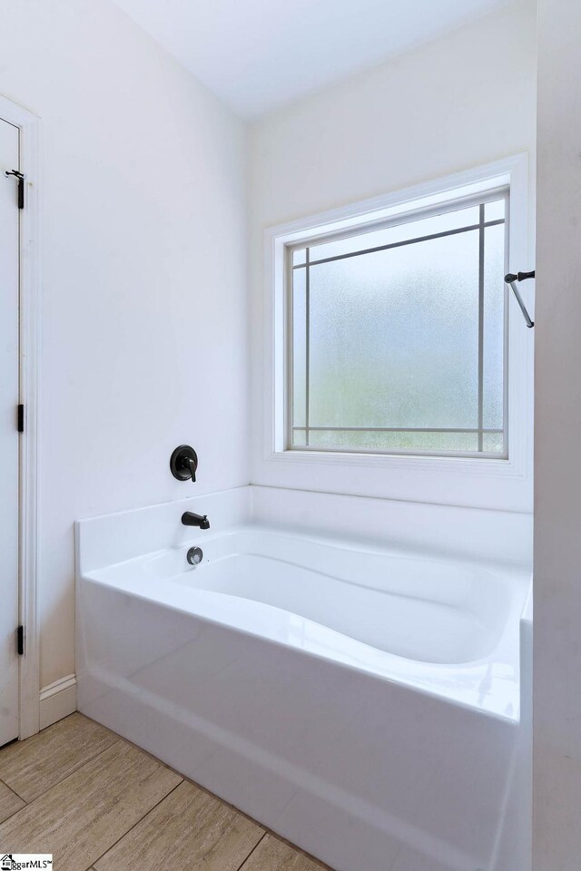 30 Caperton Way, Greer, SC 29651 - full bath featuring a garden tub and wood finished floors