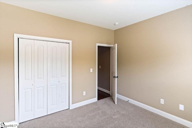 30 Caperton Way, Greer, SC 29651 - unfurnished bedroom with light carpet, baseboards, and a closet