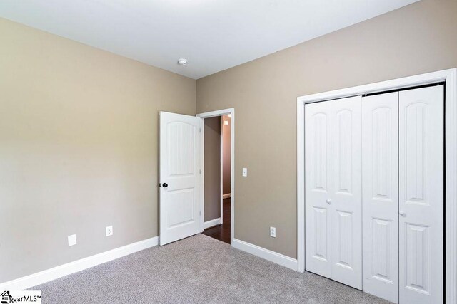 30 Caperton Way, Greer, SC 29651 - unfurnished bedroom with carpet, baseboards, and a closet