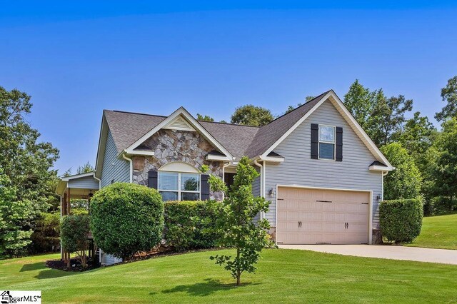 30 Caperton Way, Greer, SC 29651 - view of front of property with stone siding, driveway, an attached garage, and a front lawn