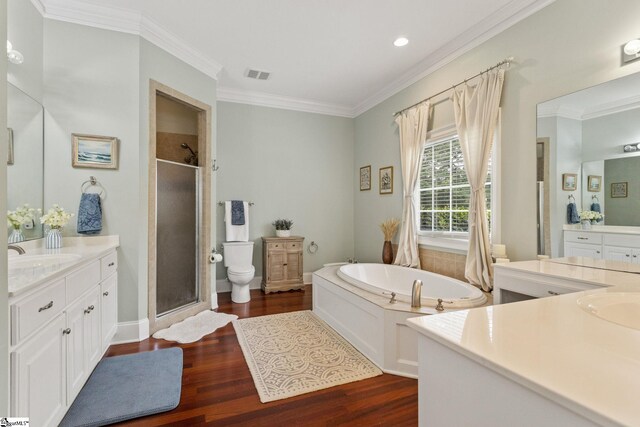 5 Fife Ct, Simpsonville, SC 29681 - full bath featuring a stall shower, two vanities, wood finished floors, crown molding, and a garden tub