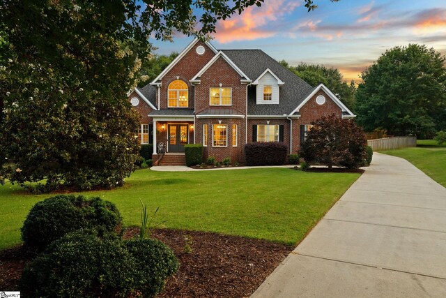 5 Fife Ct, Simpsonville, SC 29681 - traditional-style home featuring brick siding, french doors, and a lawn