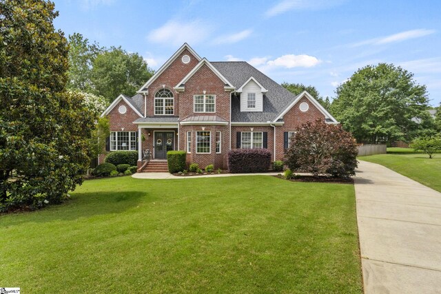 5 Fife Ct, Simpsonville, SC 29681 - view of front of house with brick siding, a front yard, driveway, and roof with shingles