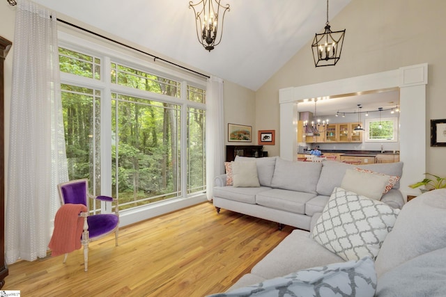 6 Terrapin Trl, Taylors, SC 29687 - living room featuring a chandelier, wood finished floors, and high vaulted ceiling