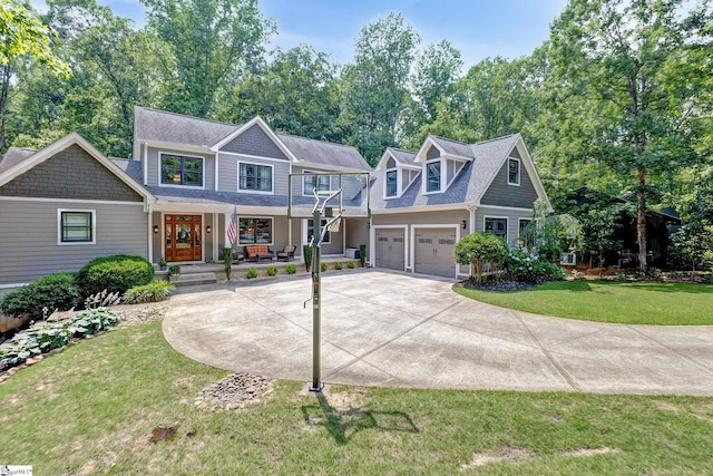 6 Terrapin Trl, Taylors, SC 29687 - view of front of house featuring a porch, concrete driveway, a front lawn, and a garage
