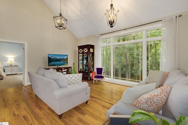 6 Terrapin Trl, Taylors, SC 29687 - living room with a chandelier, high vaulted ceiling, and wood finished floors