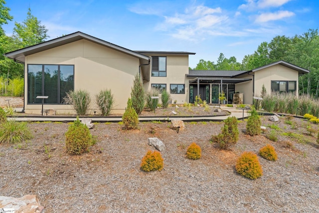 128 Sanctuary Ln, Taylors, SC 29687 - rear view of property featuring stucco siding