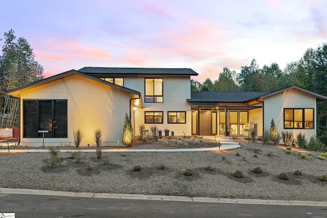 128 Sanctuary Ln, Taylors, SC 29687 - contemporary home with stucco siding and covered porch