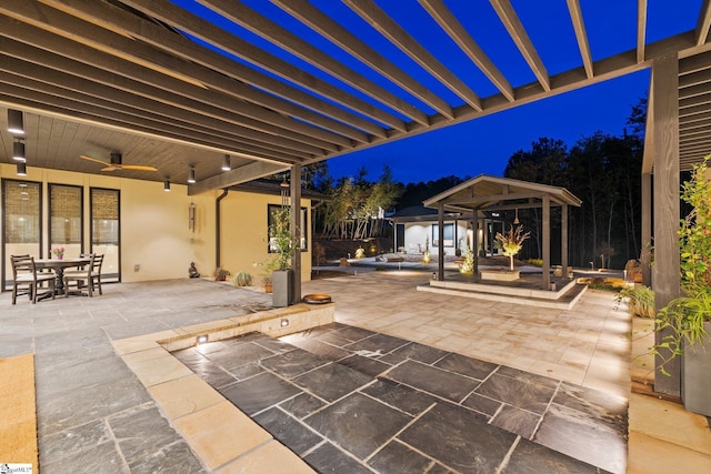 128 Sanctuary Ln, Taylors, SC 29687 - patio at twilight featuring a ceiling fan, a patio, a gazebo, and outdoor dining space