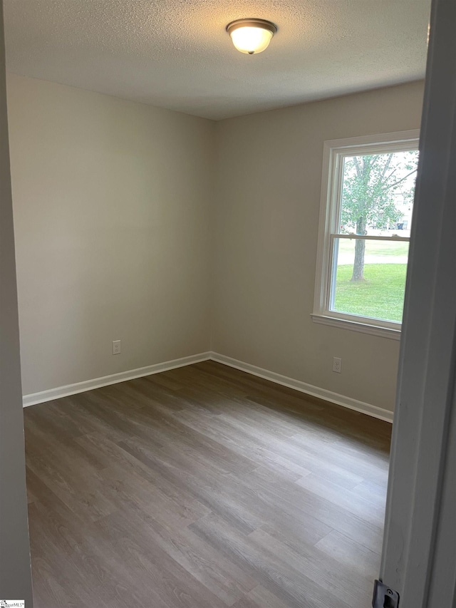 400 Mason Rd, Inman, SC 29349 - empty room featuring dark wood-style floors, baseboards, and a textured ceiling