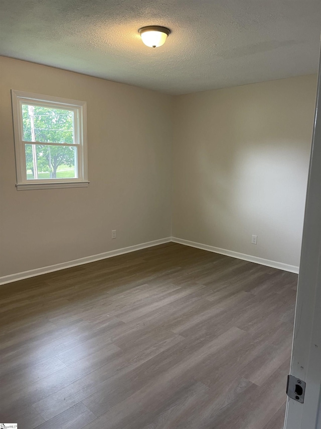 400 Mason Rd, Inman, SC 29349 - unfurnished room featuring dark wood-style floors, baseboards, and a textured ceiling