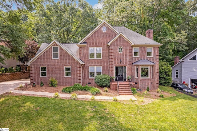 119 Circle Slope Dr, Simpsonville, SC 29681 - view of front of house featuring a chimney, a front yard, and brick siding