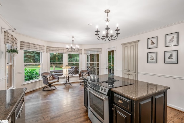 119 Circle Slope Dr, Simpsonville, SC 29681 - kitchen with a chandelier, stainless steel range with electric stovetop, wood finished floors, ornamental molding, and dark brown cabinetry