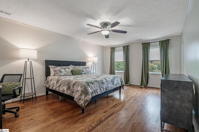 119 Circle Slope Dr, Simpsonville, SC 29681 - bedroom with ornamental molding, a textured ceiling, wood finished floors, ceiling fan, and baseboards