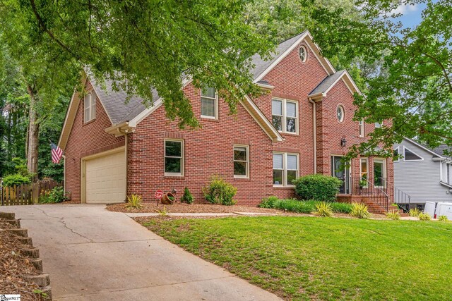 119 Circle Slope Dr, Simpsonville, SC 29681 - view of front of house with concrete driveway, brick siding, a garage, and a shingled roof