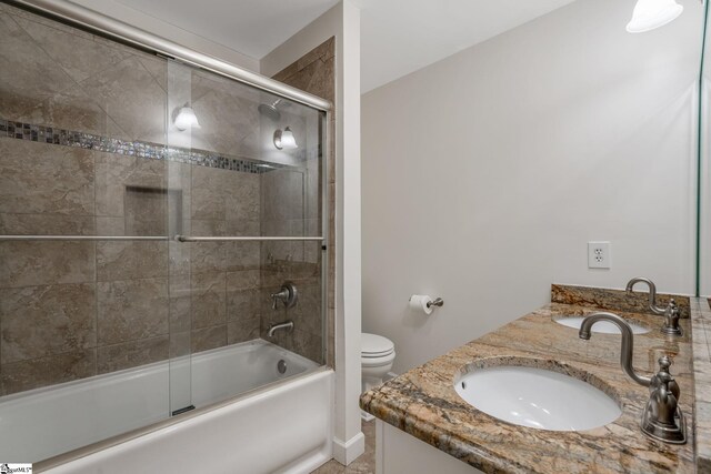 119 Circle Slope Dr, Simpsonville, SC 29681 - bathroom with bath / shower combo with glass door, double vanity, and toilet
