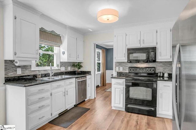 16 Chariot Ln, Simpsonville, SC 29681 - kitchen with black appliances, a sink, white cabinetry, decorative backsplash, and ornamental molding