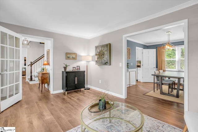 16 Chariot Ln, Simpsonville, SC 29681 - living area with wood finished floors, crown molding, stairway, and baseboards