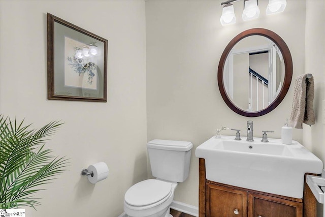 16 Chariot Ln, Simpsonville, SC 29681 - bathroom with toilet, vanity, and baseboards