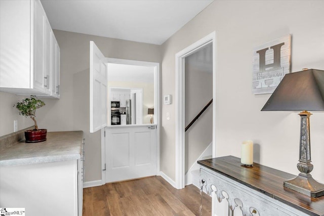 16 Chariot Ln, Simpsonville, SC 29681 - corridor with dark wood finished floors and baseboards