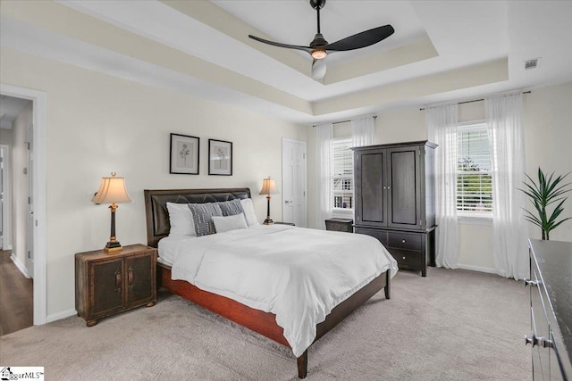 16 Chariot Ln, Simpsonville, SC 29681 - bedroom with light carpet, baseboards, a raised ceiling, and ceiling fan