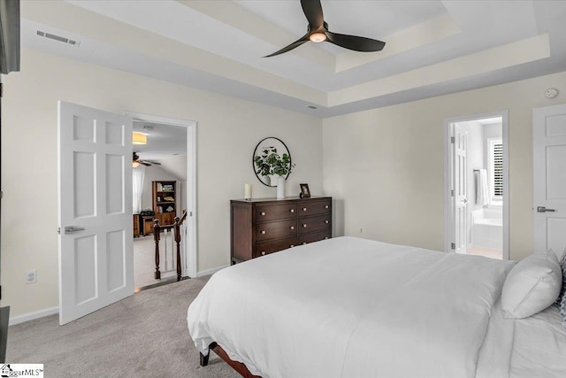 16 Chariot Ln, Simpsonville, SC 29681 - bedroom with light carpet, a tray ceiling, baseboards, and ensuite bath