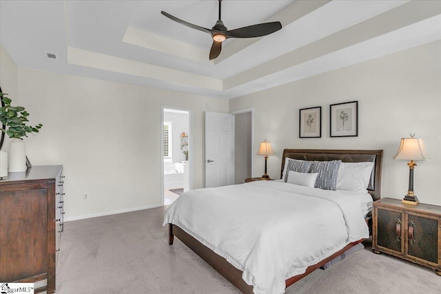 16 Chariot Ln, Simpsonville, SC 29681 - carpeted bedroom featuring a tray ceiling, baseboards, a ceiling fan, and ensuite bathroom