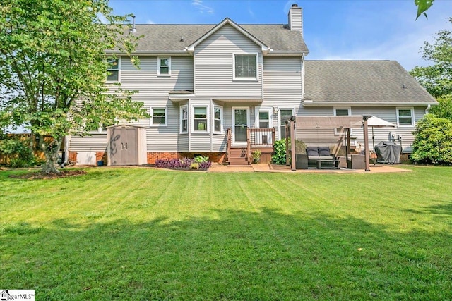 16 Chariot Ln, Simpsonville, SC 29681 - rear view of house featuring a deck, a chimney, a lawn, and a shingled roof