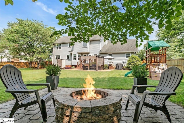 16 Chariot Ln, Simpsonville, SC 29681 - view of patio with an outdoor fire pit, a playground, and a deck