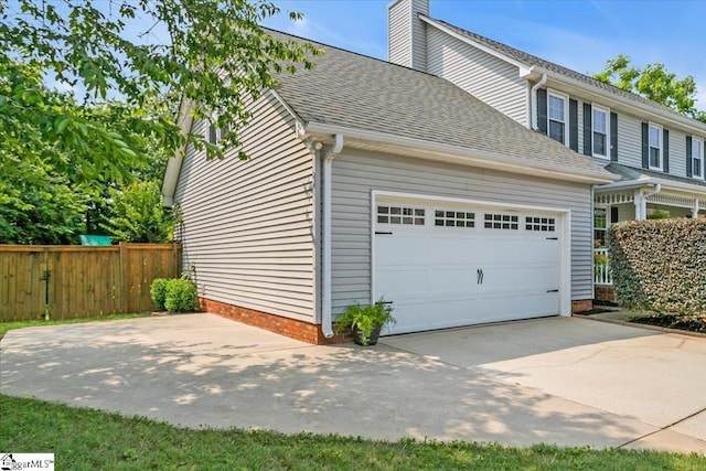 16 Chariot Ln, Simpsonville, SC 29681 - view of front of property with roof with shingles, driveway, a chimney, and an attached garage