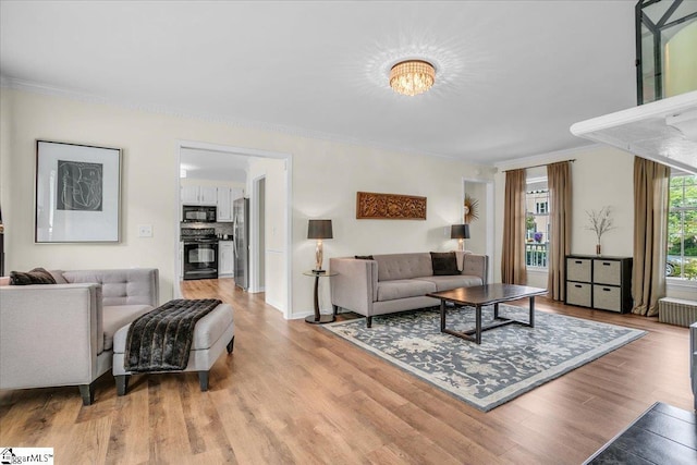 16 Chariot Ln, Simpsonville, SC 29681 - living room featuring light wood-style flooring and ornamental molding