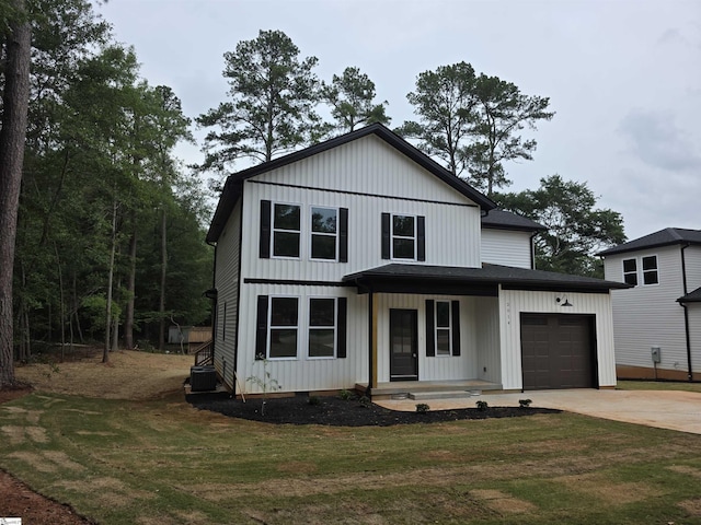 2014 Driftwood Way, Anderson, SC 29625 - modern farmhouse featuring an attached garage, covered porch, concrete driveway, a front yard, and roof with shingles