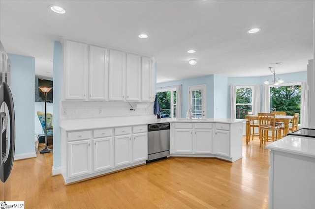30 Chalice Hill Ln, Travelers Rest, SC 29690 - kitchen featuring stainless steel appliances, light wood finished floors, healthy amount of natural light, a peninsula, and recessed lighting