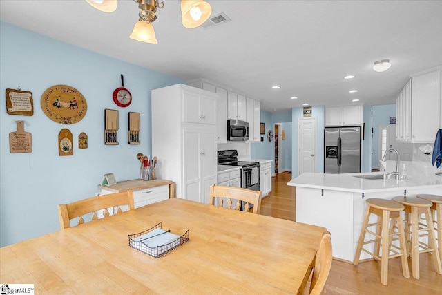 30 Chalice Hill Ln, Travelers Rest, SC 29690 - dining area with light wood-style flooring and recessed lighting