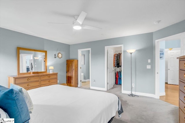 30 Chalice Hill Ln, Travelers Rest, SC 29690 - bedroom featuring baseboards, light colored carpet, a spacious closet, ensuite bathroom, and a ceiling fan