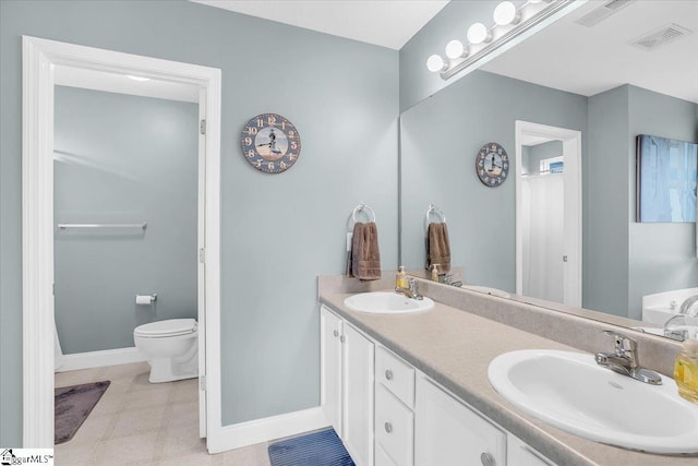 30 Chalice Hill Ln, Travelers Rest, SC 29690 - full bath featuring baseboards, double vanity, toilet, and tile patterned floors
